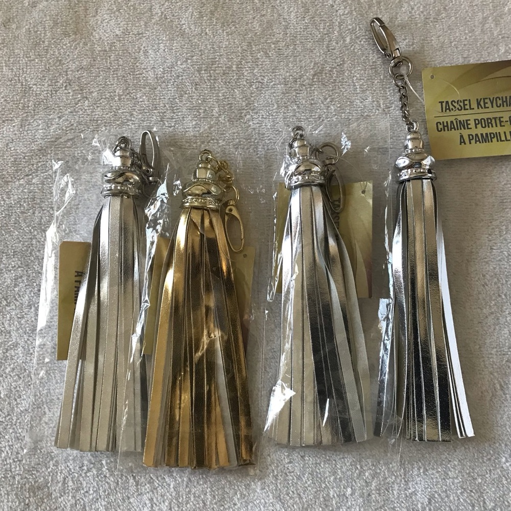 Bundle NWT 4 Tassel Keychain Bundle in PU Leather in Silver and Gold color.